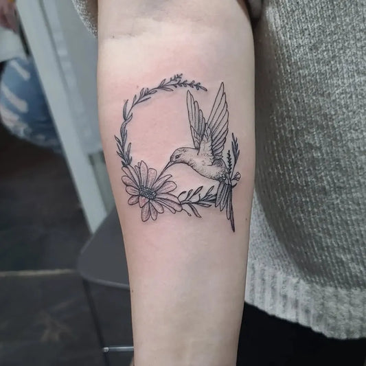 Small Fine Line Hummingbird Wreath on Women Forearm Tattoo by @carlosdelgado.tattoos