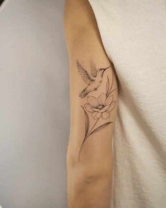 Small Fine Line Hummingbird and Flower on Women Arm Tattoo by @vinicioslira
