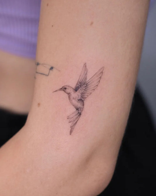 Small Fine Line Hummingbird on Women Arm Tattoo by @demetojen