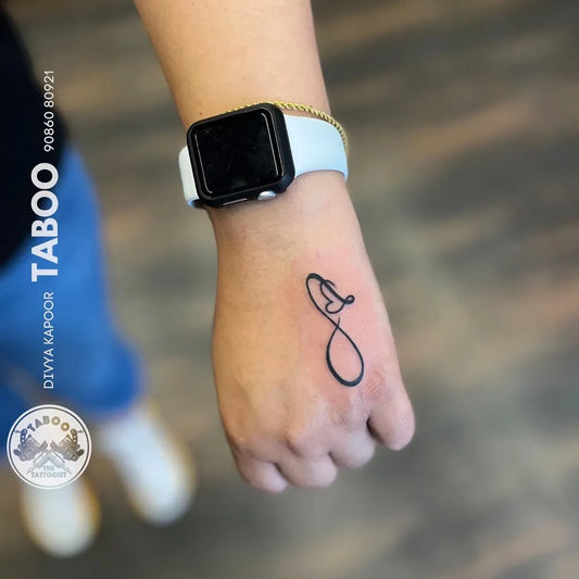 Small Fine Line Infinity Tattoo on Women Wrist by @taboothetattooist