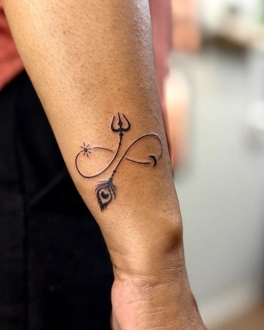 Small Fine Line Infinity Trident Peacock Tattoo on Men Wrist by @indo.ink.tattoo