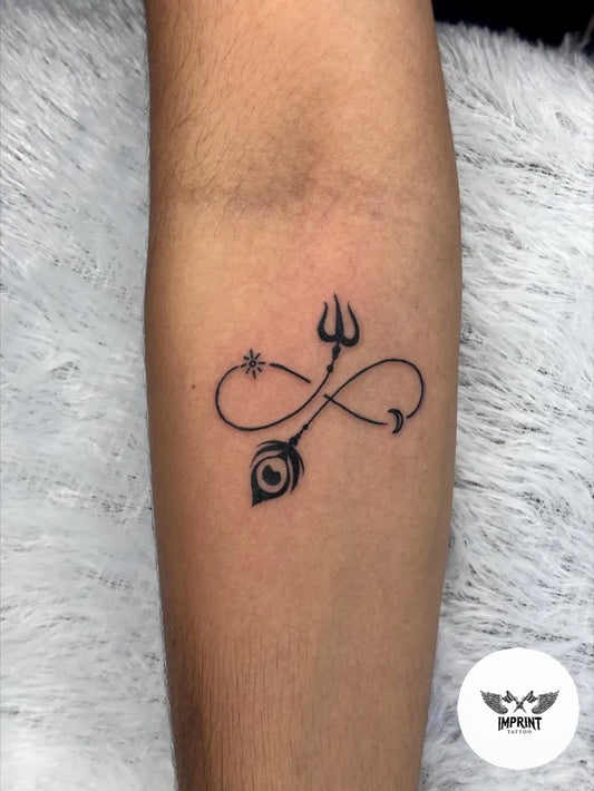 Small Fine Line Infinity Trishul Peacock Feather Tattoo on Women Forearm by @imprint_tattoo_