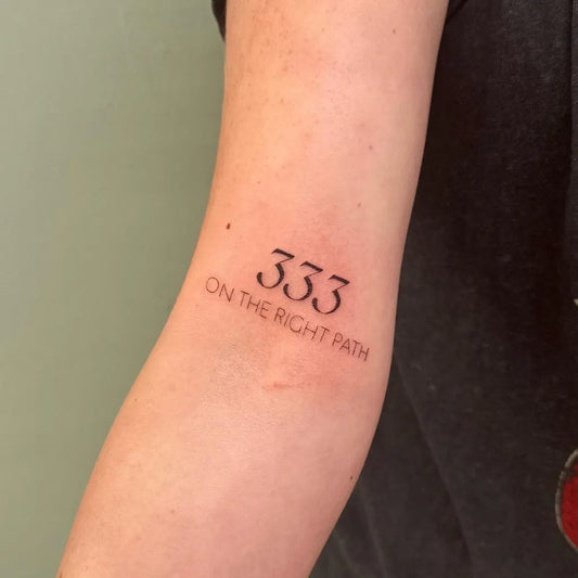 Small Fine Line Inspirational Text Number Tattoo on Women Arm by @inkedby.chlo