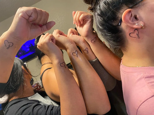 Small Fine Line Interlocking Hearts Family Tattoo on Women Wrist by @nikole_witha_k_ink