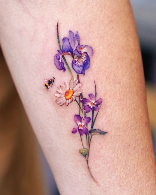 Small Fine Line Iris Daisy Bee Tattoo on Women Arm by @abii_tattoo