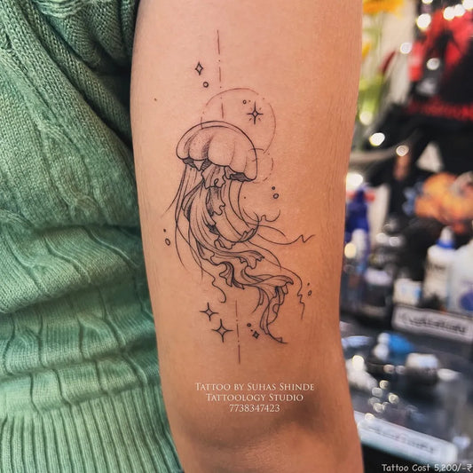 Small Fine Line Jellyfish with Geometric Elements Tattoo on Women Arm by @tattoology_studio
