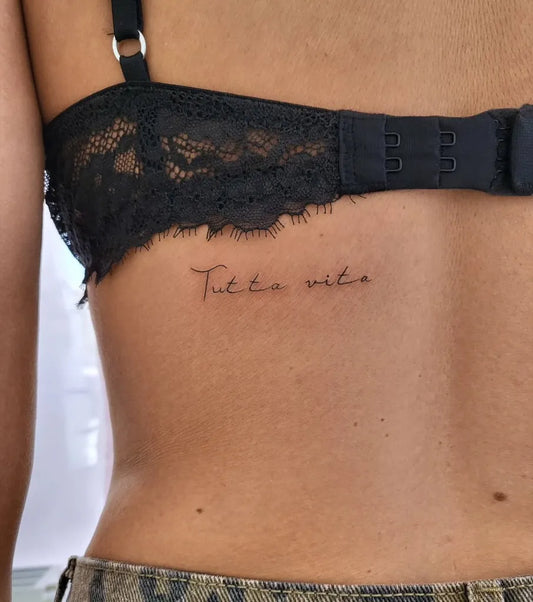 Small Fine Line Latin Script on Women Upper Back Tattoo by @studioantonina