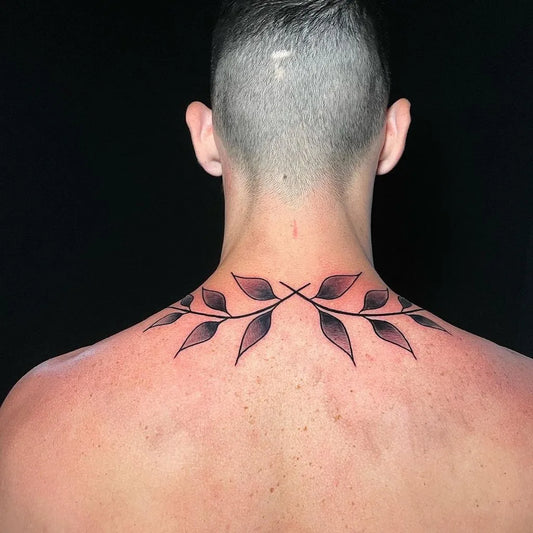 Small Fine Line Laurel Wreath Tattoo on Men Back by @blacklines_tattoostudio