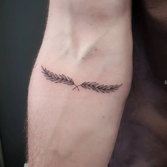 Small Fine Line Laurel Wreath Tattoo on Men Forearm by @tattoostudiodeluxe