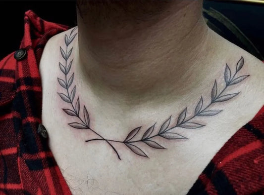 Small Fine Line Laurel Wreath Tattoo on Men Neck by @slickstyledsteel