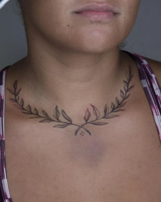Small Fine Line Laurel Wreath Tattoo on Women Neck by @nova.star.studio