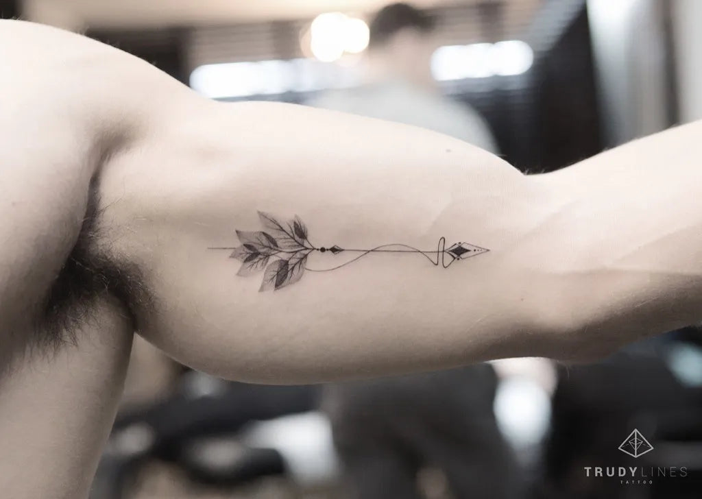 Small Fine Line Leaf Arrow Tattoo on Men Arm by @trudy_lines_tattoo