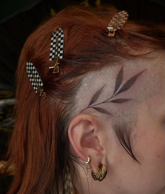 Small Fine Line Leaf Tattoo on Women Head by @keirra.tattoos