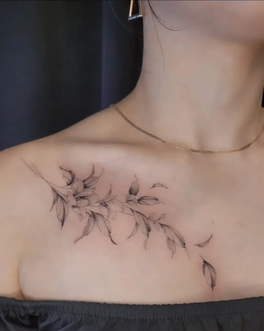 Small Fine Line Leaves Tattoo on Women Collarbone by @nala.ink