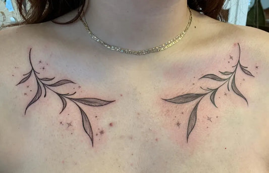 Small Fine Line Leaves and Stars Tattoo on Women Collarbone by @grackle.kin