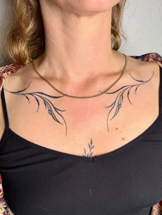 Small Fine Line Leaves on Women Chest Tattoo by @ava.ink