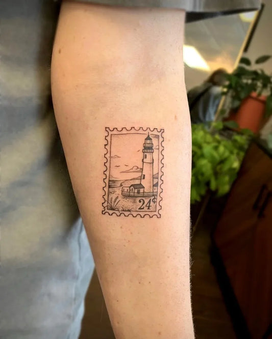 Small Fine Line Lighthouse Stamp Tattoo on Men Arm by @sullivan.tattoos