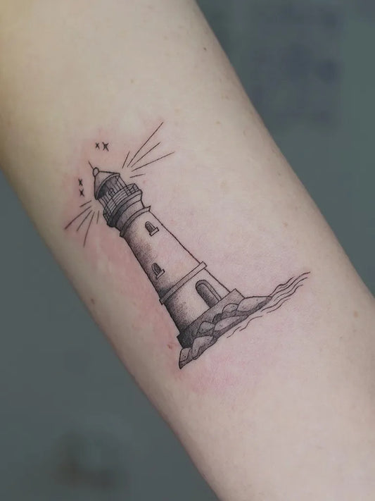 Small Fine Line Lighthouse Tattoo on Women Arm by @acetattoos_