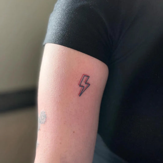 Small Fine Line Lightning Bolt Tattoo on Women Arm by @inkin_ad