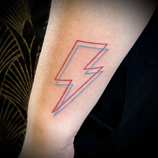 Small Fine Line Lightning Bolt Tattoo on Women Wrist by @mariamaidanatattoo