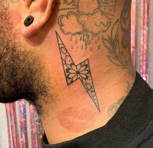 Small Fine Line Lightning Bolt with Flower Tattoo on Men Neck by @jolie_rouge_tattoo