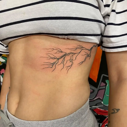 Small Fine Line Lightning Branch Tattoo on Women Rib by @alien_tattoo_ink