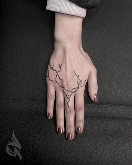 Small Fine Line Lightning Tattoo on Women Hand by @moatink