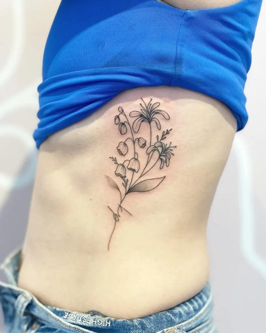 Small Fine Line Lily Flowers Tattoo on Women Rib by @jamezkan