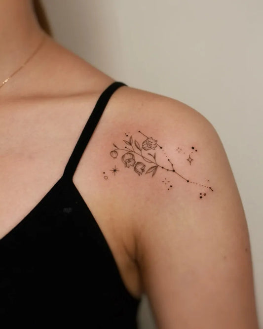 Small Fine Line Lily of the Valley Leo Constellation Roses on Women Shoulder Tattoo by @yulight_tattoo