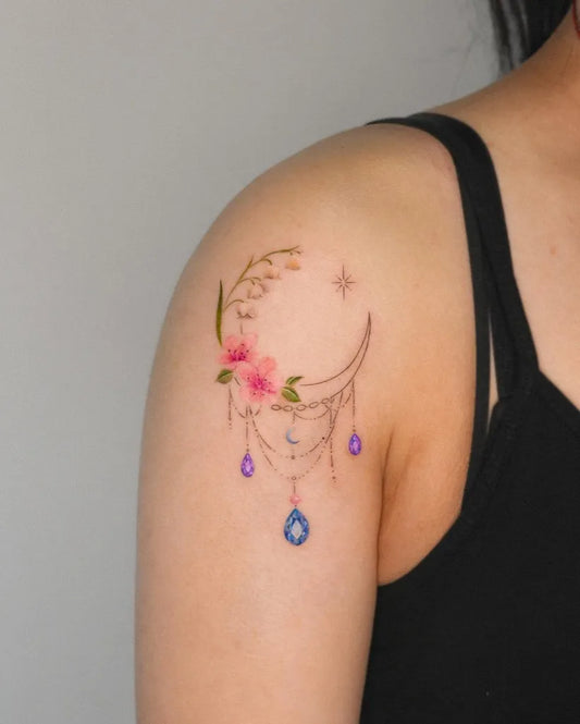 Small Fine Line Lily of the Valley Moon and Dreamcatcher on Women Shoulder Tattoo by @suya_ink