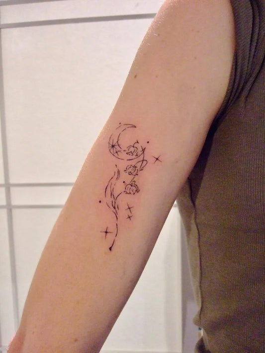 Small Fine Line Lily of the Valley Moon and Stars on Women Arm Tattoo by @leekaren.tatt