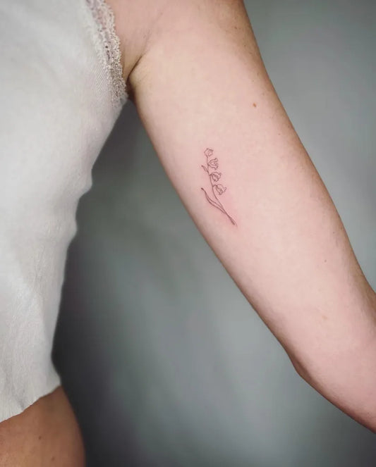 Small Fine Line Lily of the Valley Women Arm Tattoo by @ellie_s.tattoo