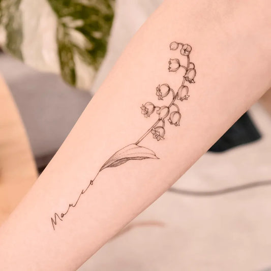 Small Fine Line Lily of the Valley and Name on Women Arm Tattoo by @eat_my_pen