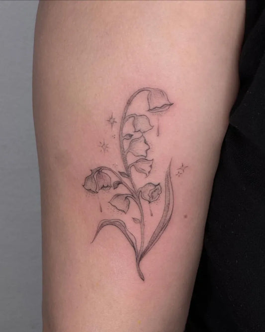 Small Fine Line Lily of the Valley with Stars on Women Arm Tattoo by @stabalisim