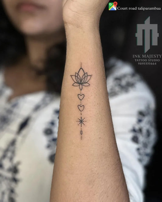 Small Fine Line Lotus Flower Heart Star on Women Wrist Tattoo by @tattoo_ink_majesty_taliparamba