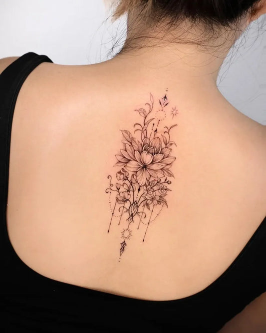 Small Fine Line Lotus Flower and Vines on Women Back Tattoo by @becca.rose.tt