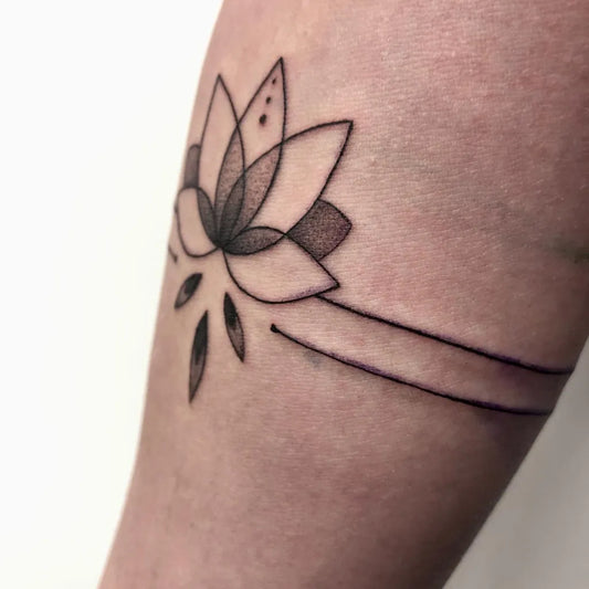 Small Fine Line Lotus Flower on Women Forearm Tattoo by @lea.tattooartist