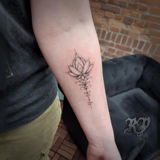 Small Fine Line Lotus Flower on Women Forearm Tattoo by @ritchie.parris