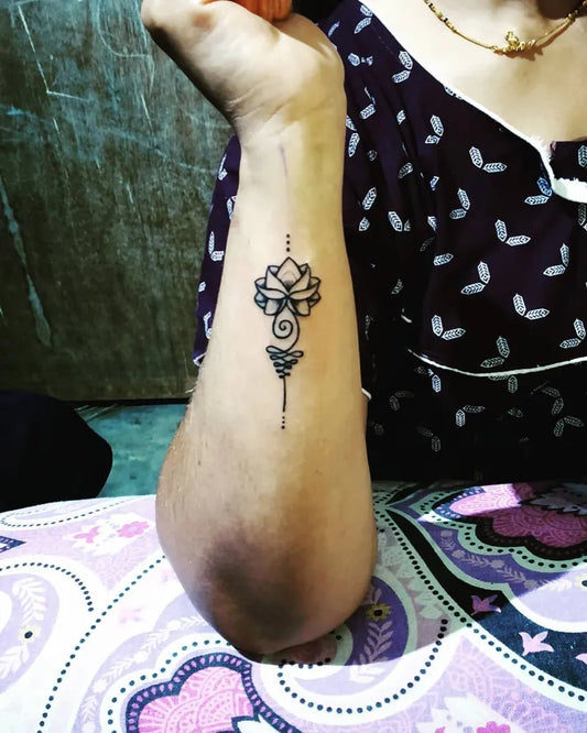 Small Fine Line Lotus Flower on Women Wrist Tattoo by @freedomtattoo_art