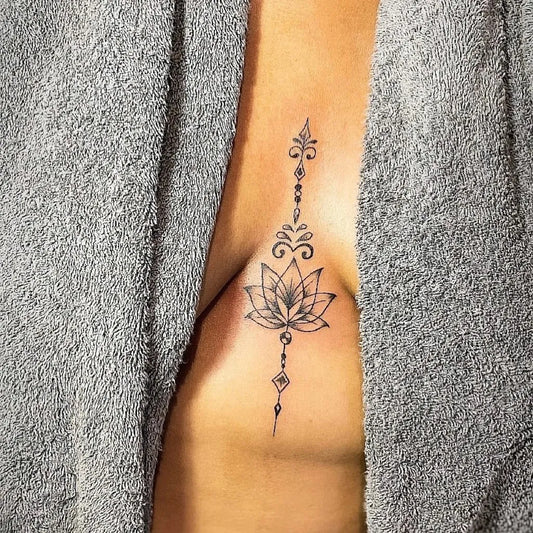 Small Fine Line Lotus Flower with Mandala Chain on Women Sternum Tattoo by @3rdinktattoos