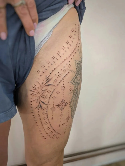 Small Fine Line Mandala Flower Drapes on Women Thigh Tattoo by @ladyfenwick_tattoo