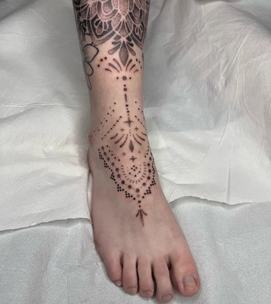 Small Fine Line Mandala Tattoo on Women Foot by @mollypaigetattoos