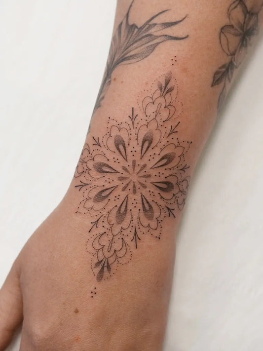 Small Fine Line Mandala Tattoo on Women Wrist by @amybillingtattoo