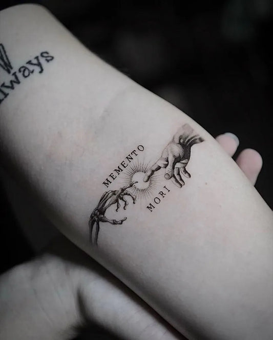 Small Fine Line Memento Mori Hands Women Arm Tattoo by @hood.seven.guests