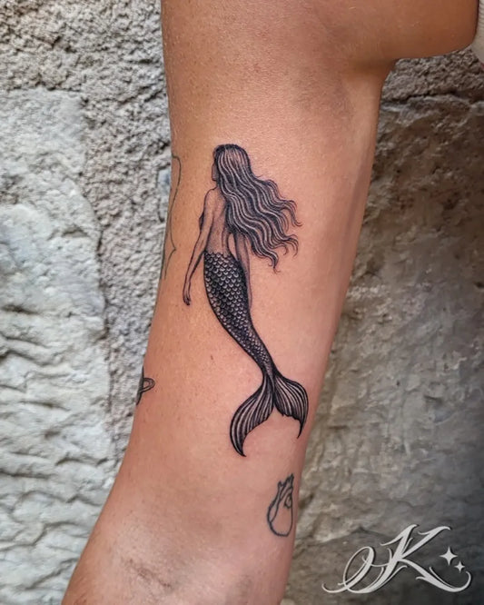 Small Fine Line Mermaid Tattoo on Women Arm by @ketty_.tattoo