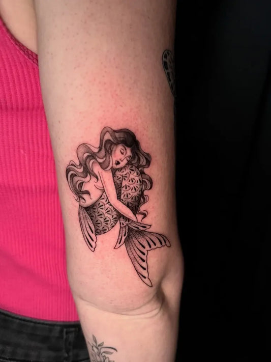 Small Fine Line Mermaids Tattoo on Women Arm by @embertatz