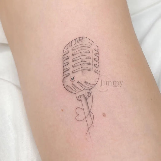 Small Fine Line Microphone with Heart and Name Music Tattoo on Women Forearm by @souljimmytattoo