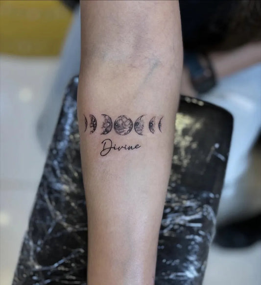 Small Fine Line Moon Phases Divine Tattoo on Women Arm by @sabrinaslivingink
