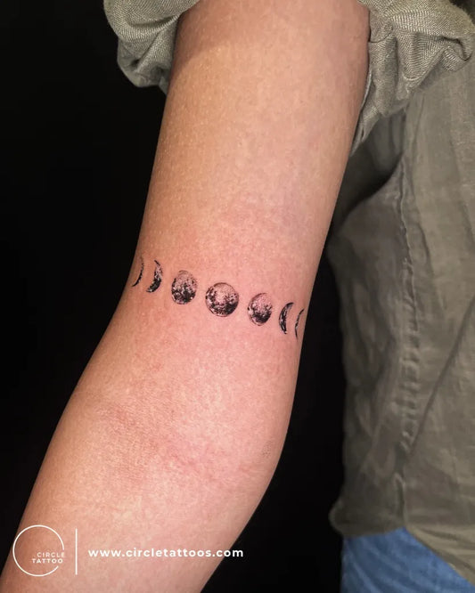 Small Fine Line Moon Phases Tattoo on Women Arm by @circletattoodadar