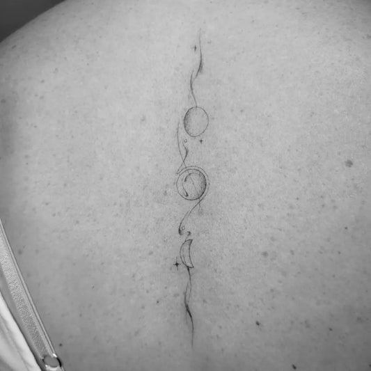 Small Fine Line Moon Phases Tattoo on Women Back by @studiohiddenblue